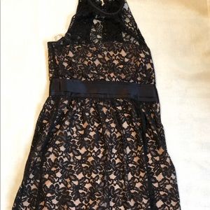 High neck, black lace dress with nude underlay